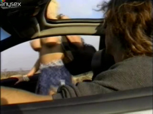 Tanned blond head Nina Cherry sucks a cock right in the car