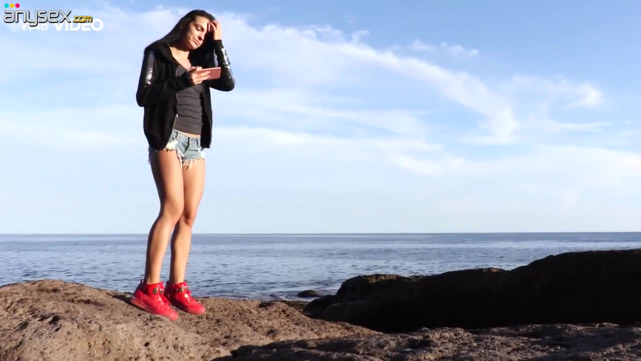 Pretty hot brunette Sapphira is flashing her tits on the rocky beach Free Porn Videos | ePornAny.