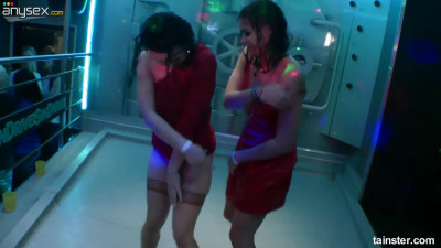 Two topless babes fondle each other under the shower in one private night club