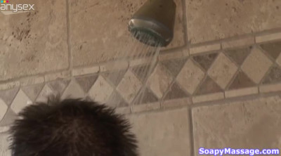 Seductive masseuse provides her man with great tugjob in the shower